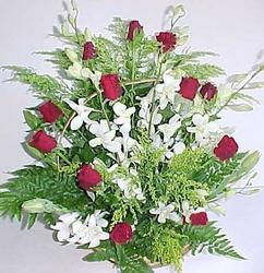 Arrangement of roses and orchids
