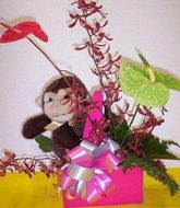 Cheeky monkey with flowers