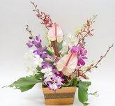 Orchid arrangement in wooden box
