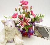 Mothers day flower arrangement    
scented teddy and chocolates